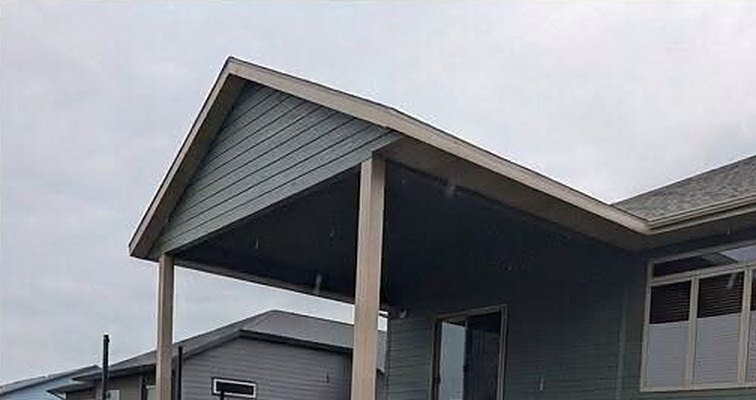Step 04 of our covered deck build: roof, siding and post wraps