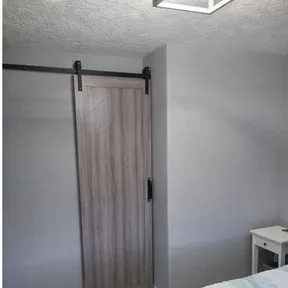 A closet we rebuilt, finished with a sliding barn door