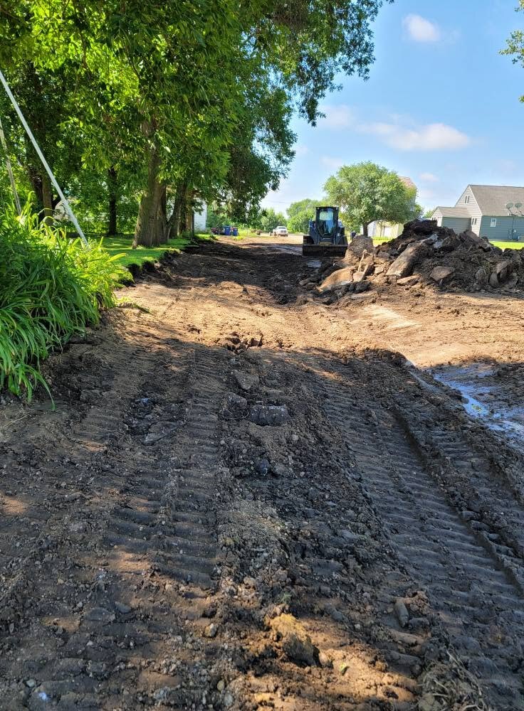 Cutting grade along a residential street. The tracks are the level.